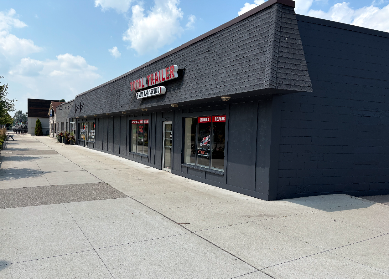 Commercial exterior painting project on a retail storefront