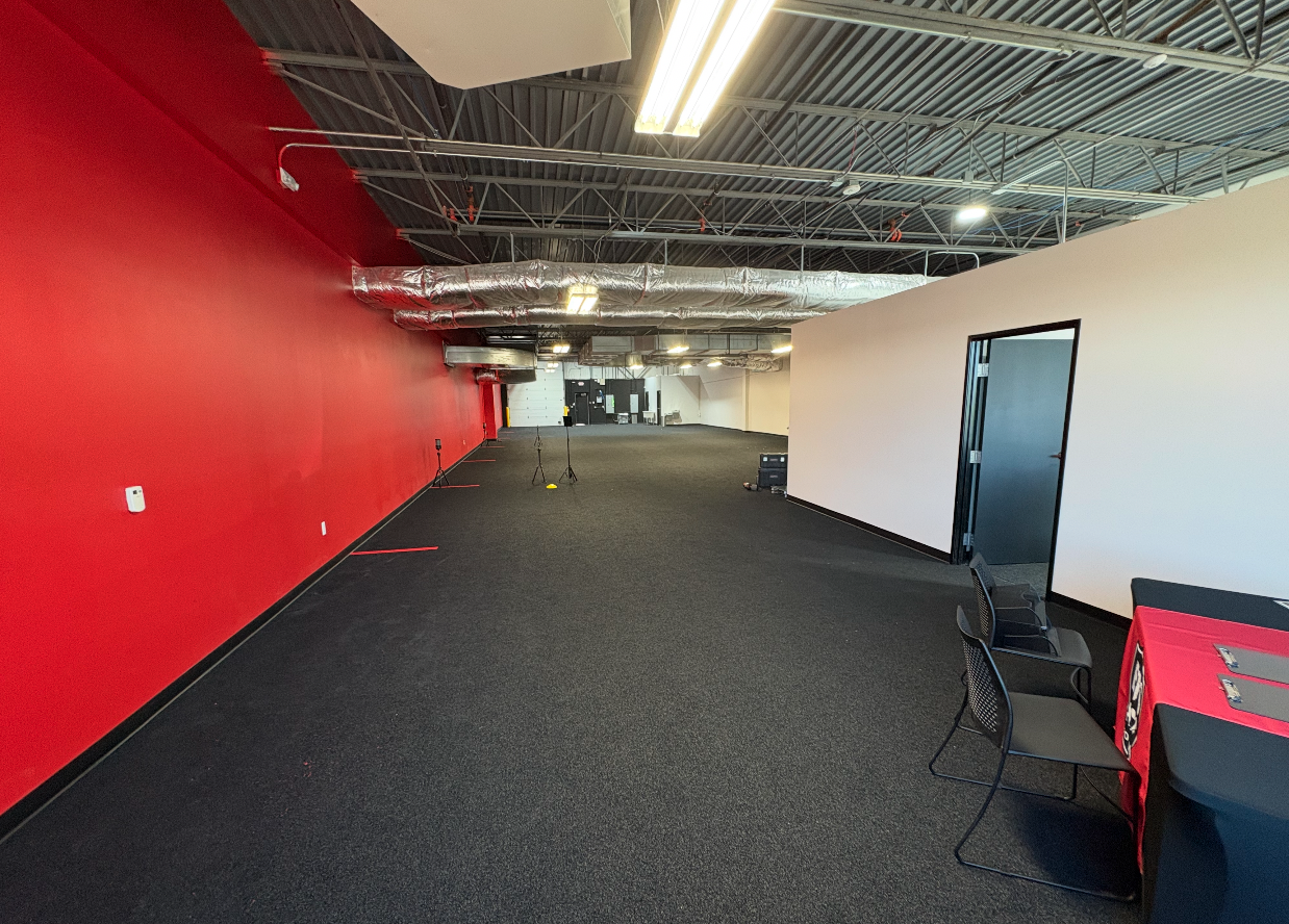 Commercial interior painting project with red accent wall
