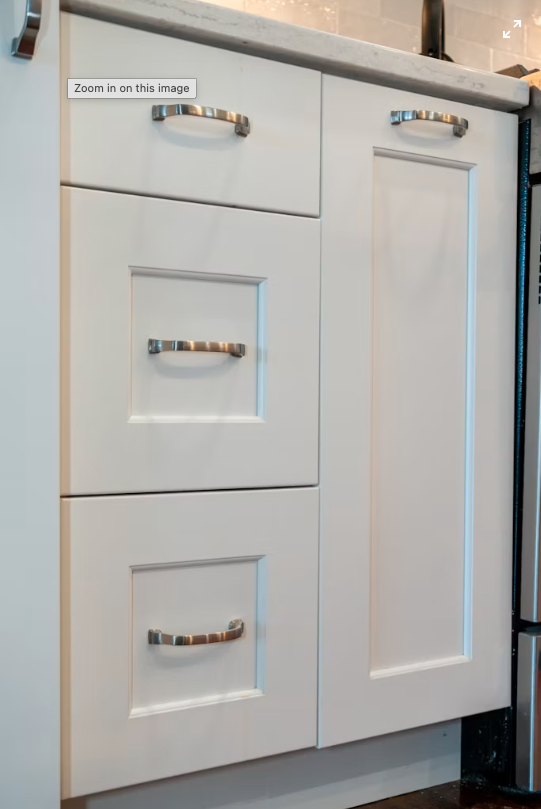 Freshly painted white kitchen cabinets by HKH Custom Coatings